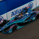 A photo of Dan Ticktum in his teal-colored Nio 333 Formula E car.